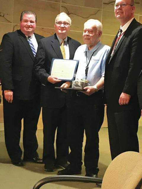 Airport board members Patrick O'Malley and Tim McGinley present volunteer Ambassador Edward Hanadel of Exeter with a plaque and a gift at Thursday's Airport Board meeting. At right is Executive Director Carl Beardsley. - Bill O'Boyle | Times Leader