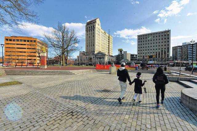  Butch Comegys | For Times Leader A family walks through Public Square in Wilkes-Barre, which is currently undergoing refurbishments. 