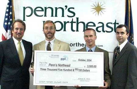 Shown are, from left, Paul Canevari, Regional Community Relations Director, PPL Electric Utilities; Richard Beasley, Regional Community Relations Director, PPL Electric Utilities; Mark Sincavage, Chairman, Penn's Northeast and Jim Cummings, President, Penn's Northeast.