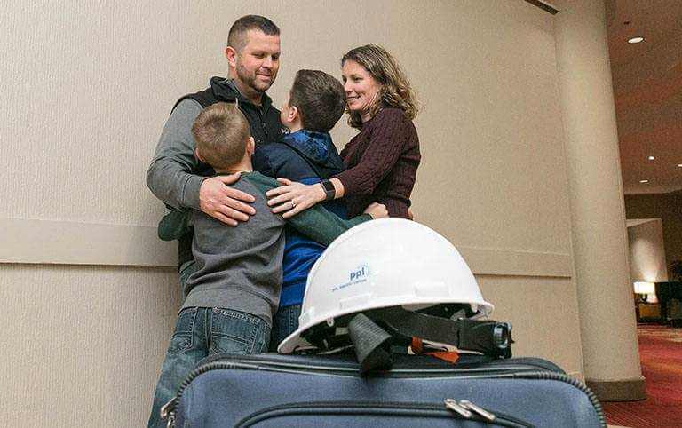 PPL Journeyman Lineman Jason Roberts of Lackawanna County shares a moment with his family before leaving for a month of power restoration work in Puerto Rico.