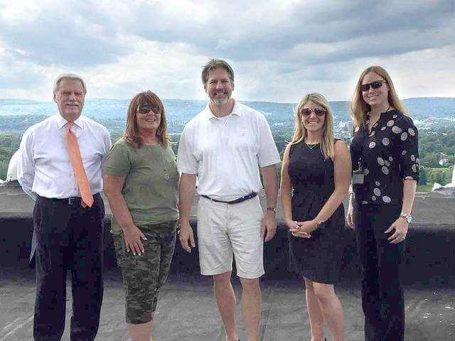 The Founders Day Committee and local media partners pose on the rooftop of the Citizens Bank Building, downtown Wilkes-Barre for special future Founders Day event planning. From Left to right Mike Murray, Times Leader Media Group Publisher, Patty Hughes, Wilkes-Barre City Special Events Coordinator, Tony Brooks, Director and Curator of the Wilkes-Barré Preservation Society, Lindsay Griffin, Vice President of Greater Wilkes-Barre Chamber of Commerce and Kerry Miscavage, Times Leader Media Group Vice President of Sales and Marketing. Missing are Cassie Fiume, Diamond City Partnership Marketing Coordinator and Kathy Bozinski, United Way, Director of Marketing and Communications. - Submitted photo