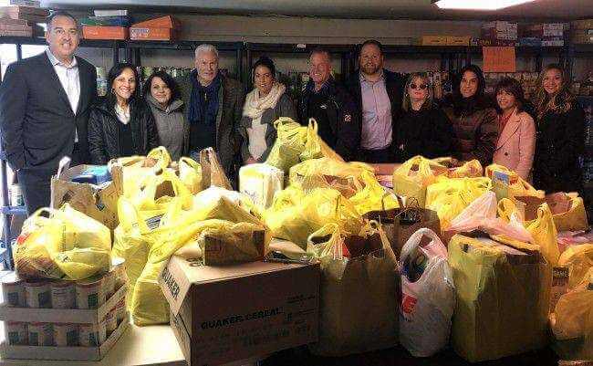 SUBMITTED PHOTO Wolf Commerical Real Estate (WCRE) is helping feed neighbors with its fifth annual Thanksgiving Food Drive, Pictured from left, Jason Wolf (WCRE), Miriam Feldman (Jewish Family and Children's Service, JFCS), April Loomis (WCRE), Tom Bove (WCRE), Tammi Coppinger (WCRE), Brian Propp (WCRE), Ryan Barikian (WCRE), Stephanie Carroll (WCRE), Marla Meyers (JFCS), Beth Wynne (JFCS) and Nora Farghaly (WCRE).